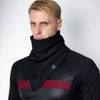 Black infinity scarf worn as face cover, textured jersey snood with tag detail, styled with fitted long sleeve techwear top on male model, minimal studio background