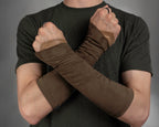 Brown suede bracers with beige armbands over the hands, crossed arms – ZOLNAR