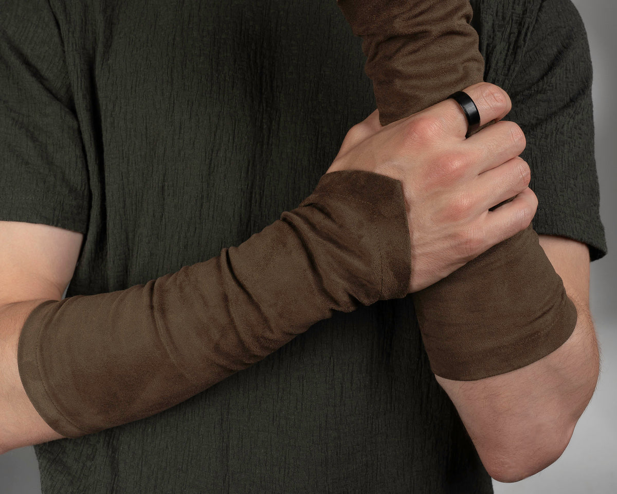 Brown suede faux leather bracers on crossed arms – ZOLNAR