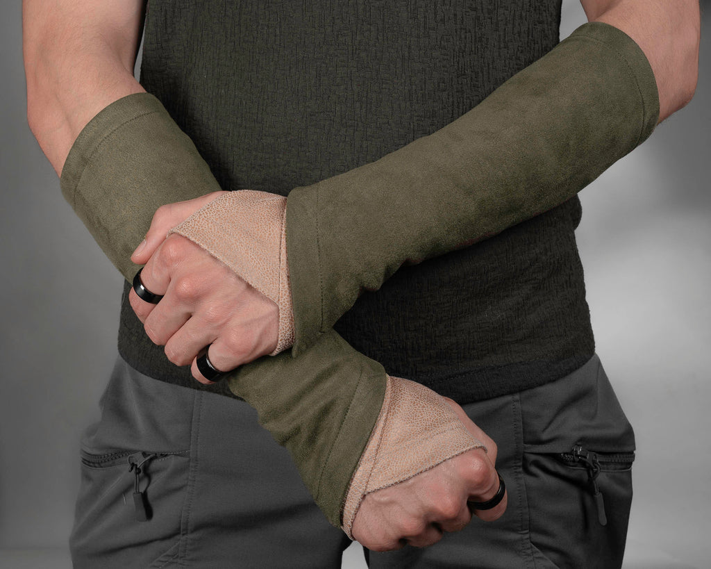 Khaki suede bracers layered with beige armband, close-up – ZOLNAR