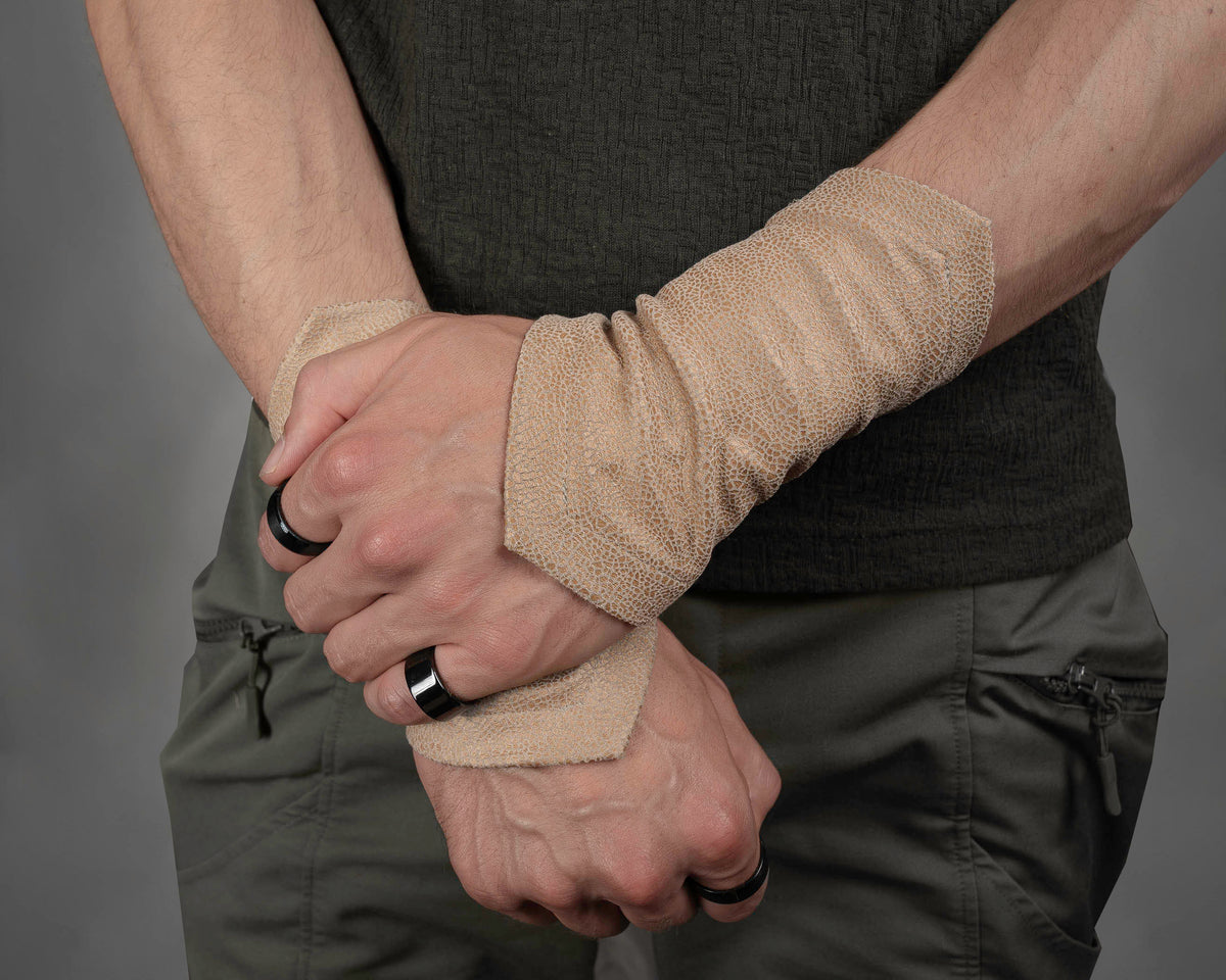 Light beige armbands worn on crossed wrists – ZOLNAR