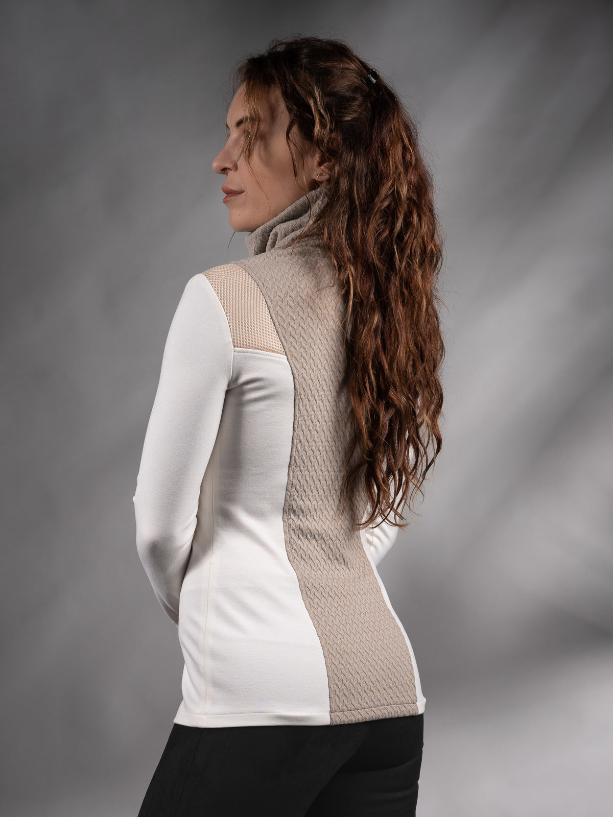 Back three-quarter view of white and beige sweater with high collar – ZOLNAR