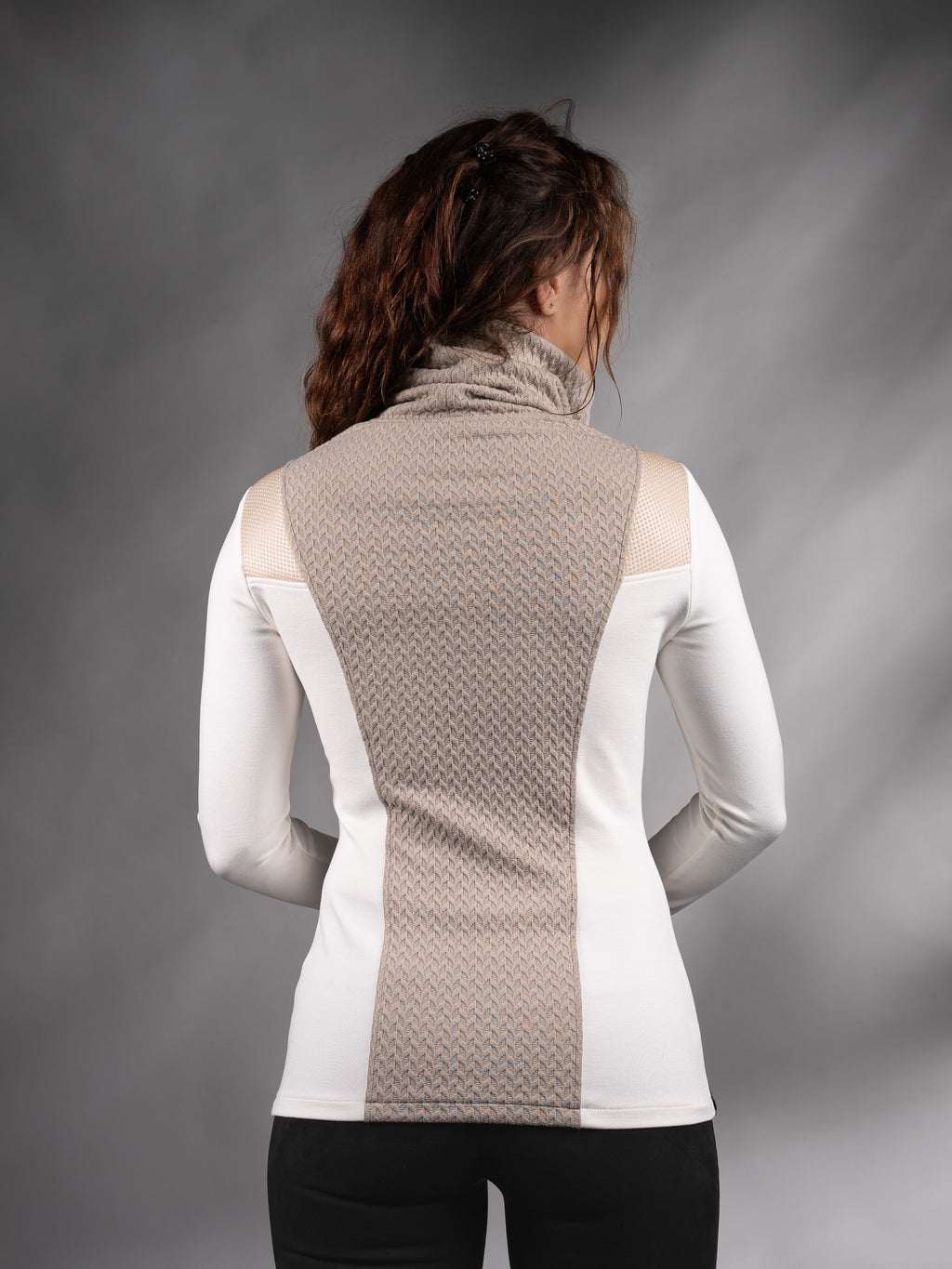 Back view of white sweater with beige textured panel and high collar – ZOLNAR