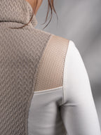 Close-up of beige cable-textured turtleneck collar and back panel – ZOLNAR