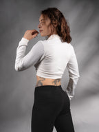 Back three-quarter view of white crop top with textured sleeves – ZOLNAR